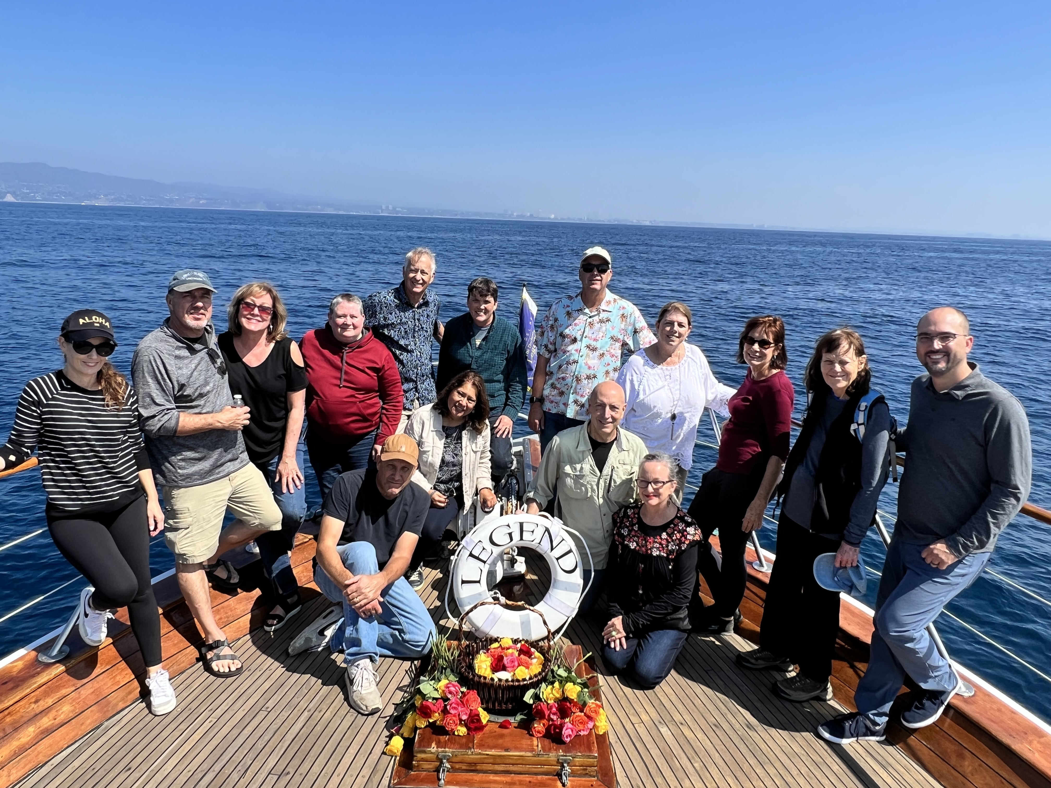 A group of family and friends gathered on the Legend's deck during a California burial at sea memorial
