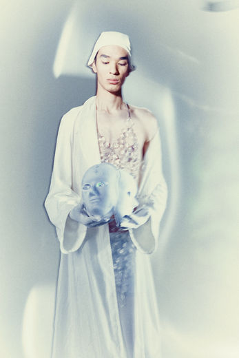 model wearing long dress in a photographic studio