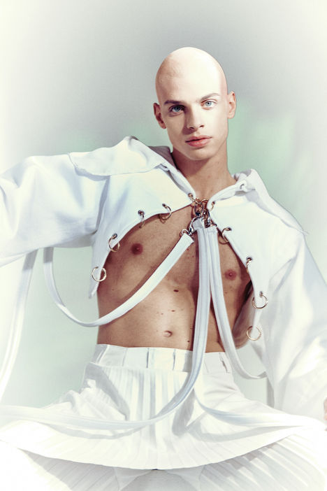 model wearing white long dress in a photographic studio