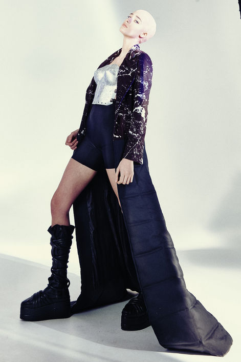 model wearing black long dress in a photographic studio