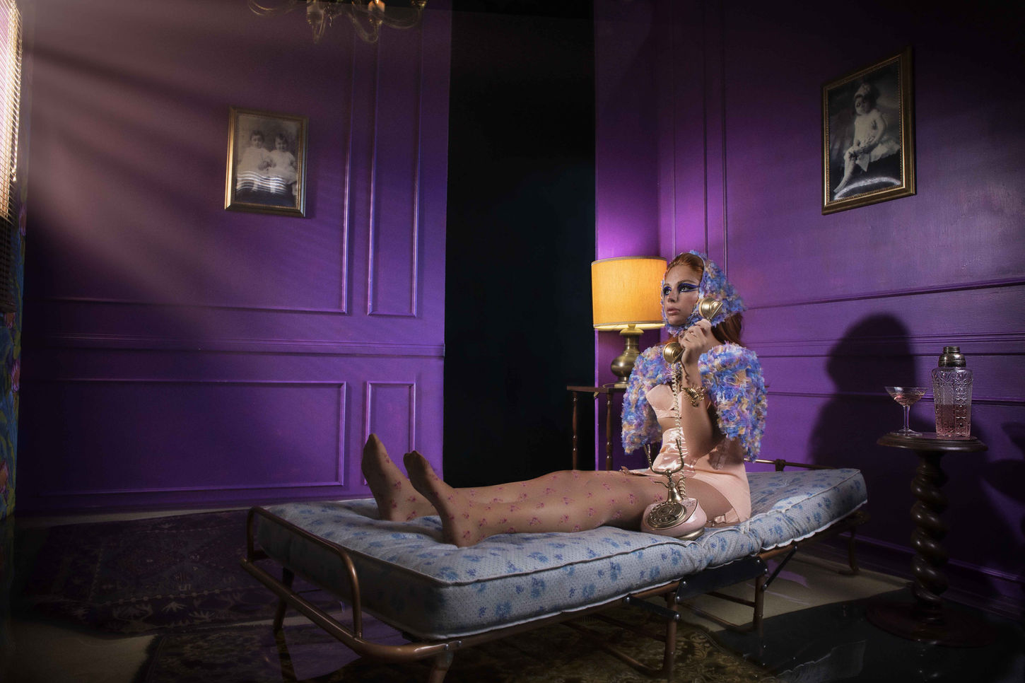 model posing with colorful outfit in a photographic set 