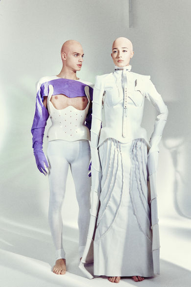 models wearing long white fashion dress in a photographic studio
