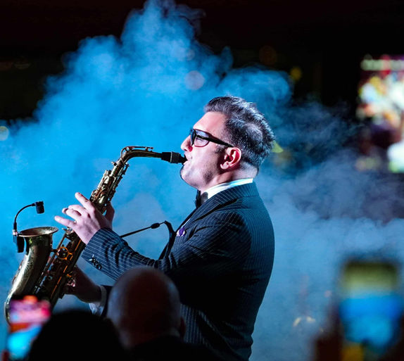 Live saxophone performance during Bosphorus dinner cruise Turkish night show in Istanbul