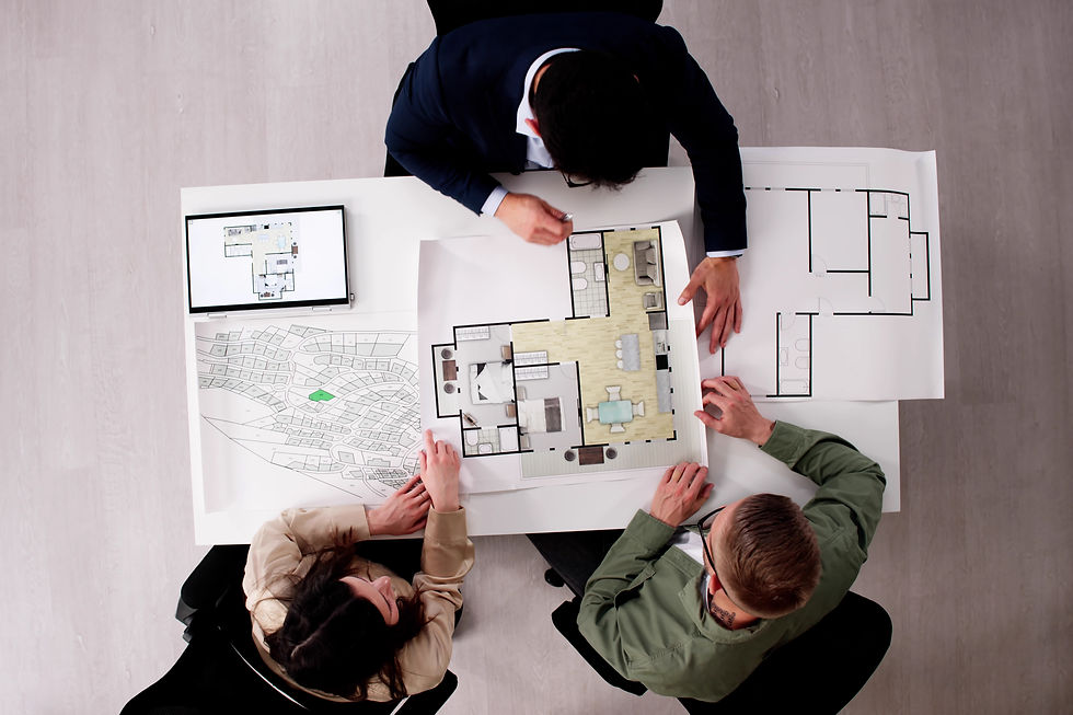 Young Couple Consult With Real Estate Agent For House Advice. Urban Planner Meets With Con