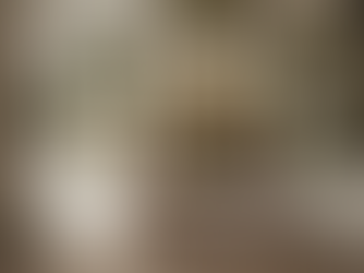 Eye-level view of a modern gallery wall displaying AI-generated digital paintings