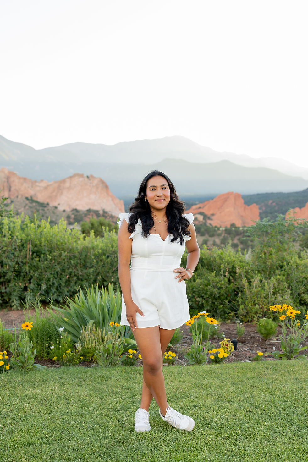 Senior standing in front of Garden of the Gods, photographed by Julie Vickers