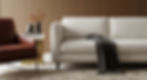 A detail shot showing an Axiom Modern interior with a white sofa, Oxblood leather chair, and a Japanese cypress acoustic paneled wall.