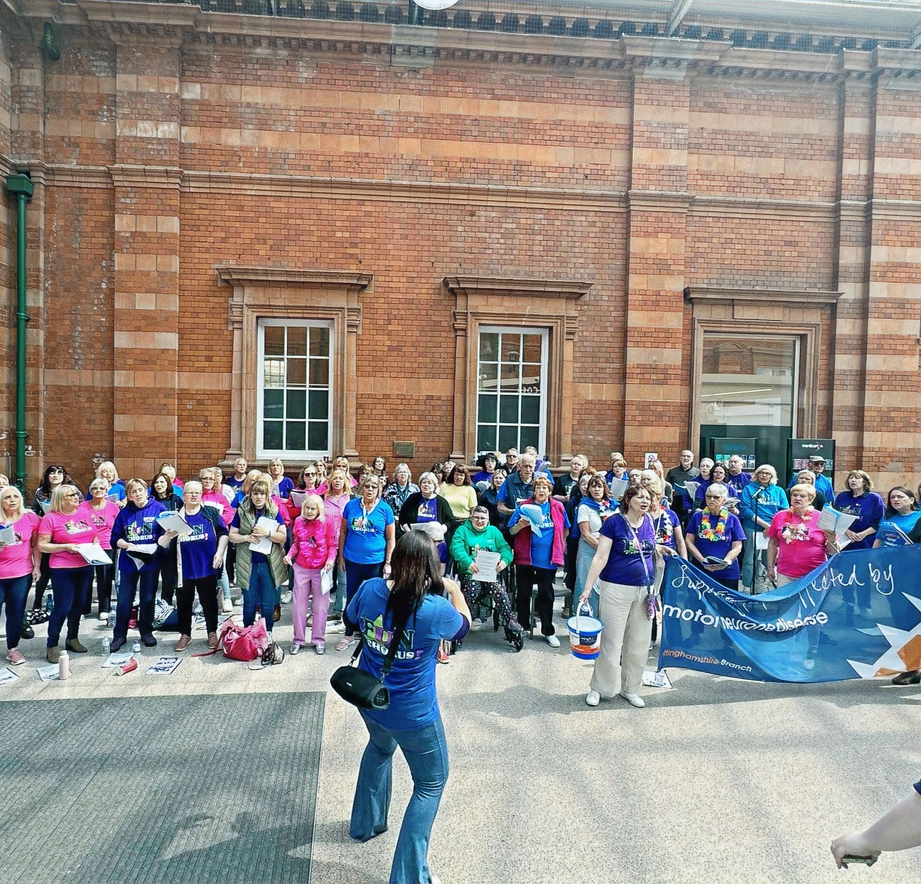 Fun Chorus performing at Nottingham Train Station