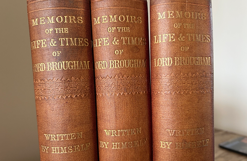 Photo of the three volumes of Lord Broughams memoirs, on brown spines with gold lettering