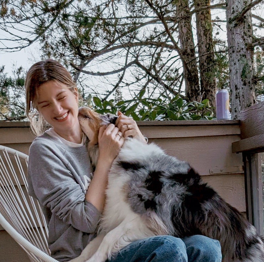 Kissamo Founder smiling with her dog, Tessa - the inspiration behind Kissamo's waterproof dog tags.