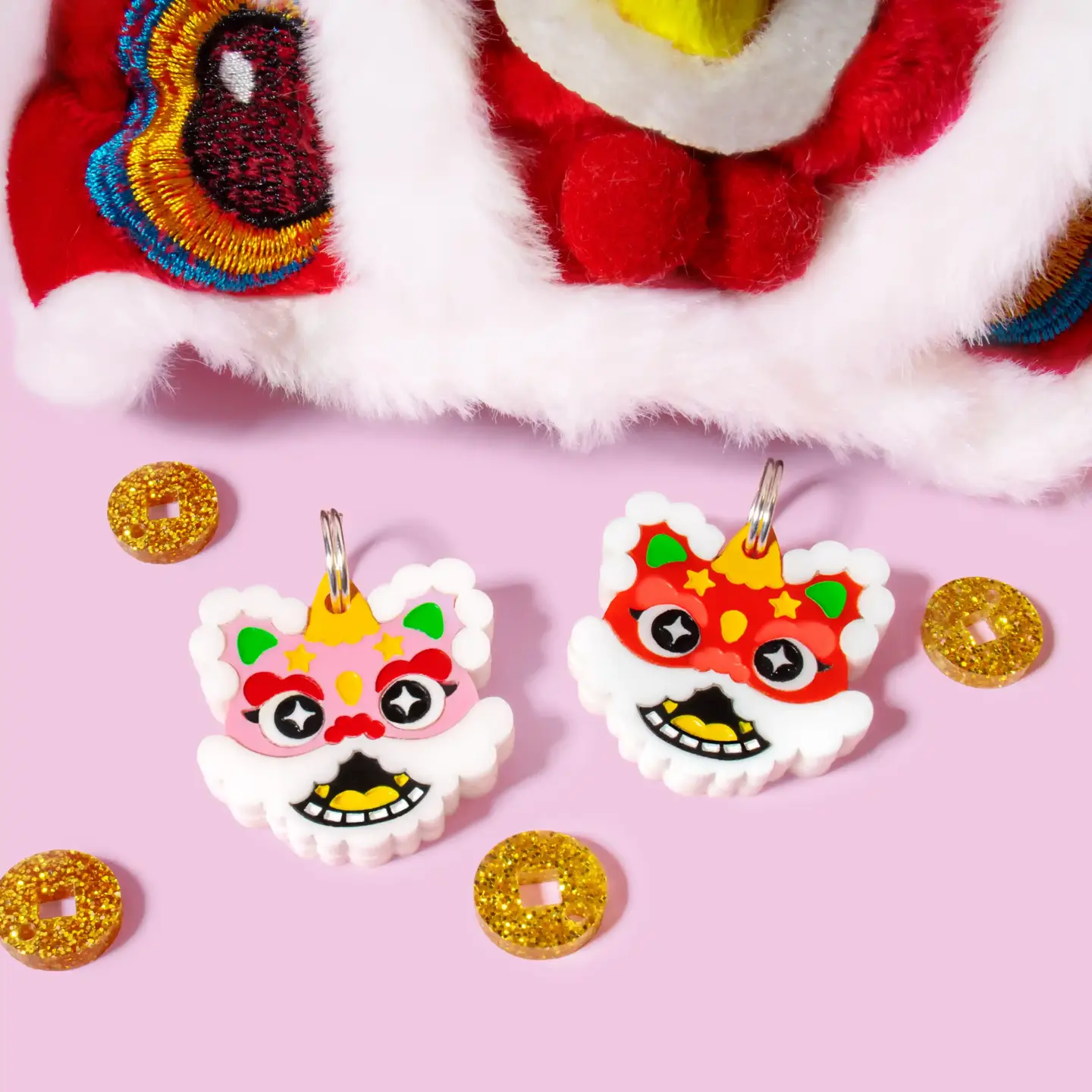 Chinese Lion Mask pet tag featuring pink and red acrylic. A handmade dog name tag for Lunar New Year.