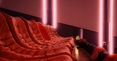 The red lounge seats along the wall at Polygon Portal