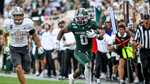 Michigan State RB Cam Edwards runs for a gain against Eastern Michigan