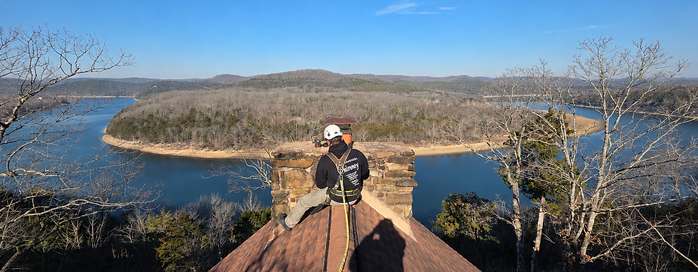 CSIA-certified chimney inspection overlooking Table Rock Lake during a professional roof inspection in Southwest Missouri.