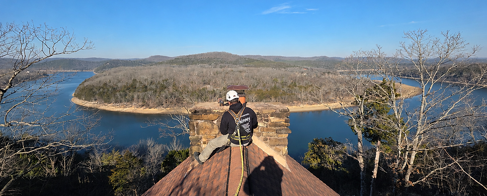 CSIA-certified chimney inspection overlooking Table Rock Lake during a professional roof inspection in Southwest Missouri.