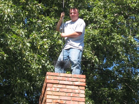 old school chimney sweeping from top