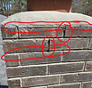 Illustration showing deteriorated mortar joints requiring chimney tuckpointing
