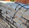 Severely cracked and weathered chimney mortar joints needing masonry restoration