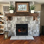 Beautiful stone fireplace and custom hearth installation completed by Lakeside Chimney.