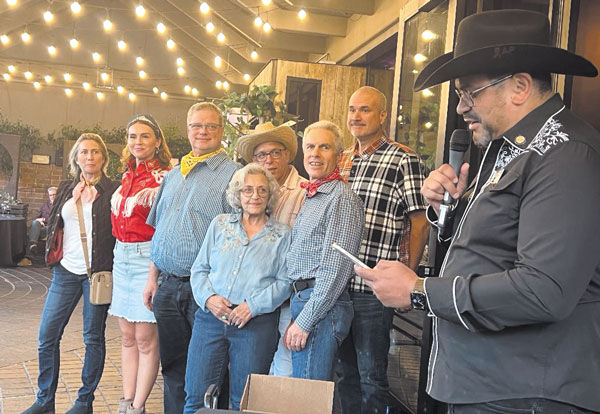 Rotary District Governor Alex Parajon, far right, dethroned the president and board including, from left, Tanya Gilbert, Secretary; Karin Wallerstein, VP; Gary Ogden, VP; Len Lanzi; and Timur Berberoglu. In front, Monika White and Ken Waltzer, past presidents.
