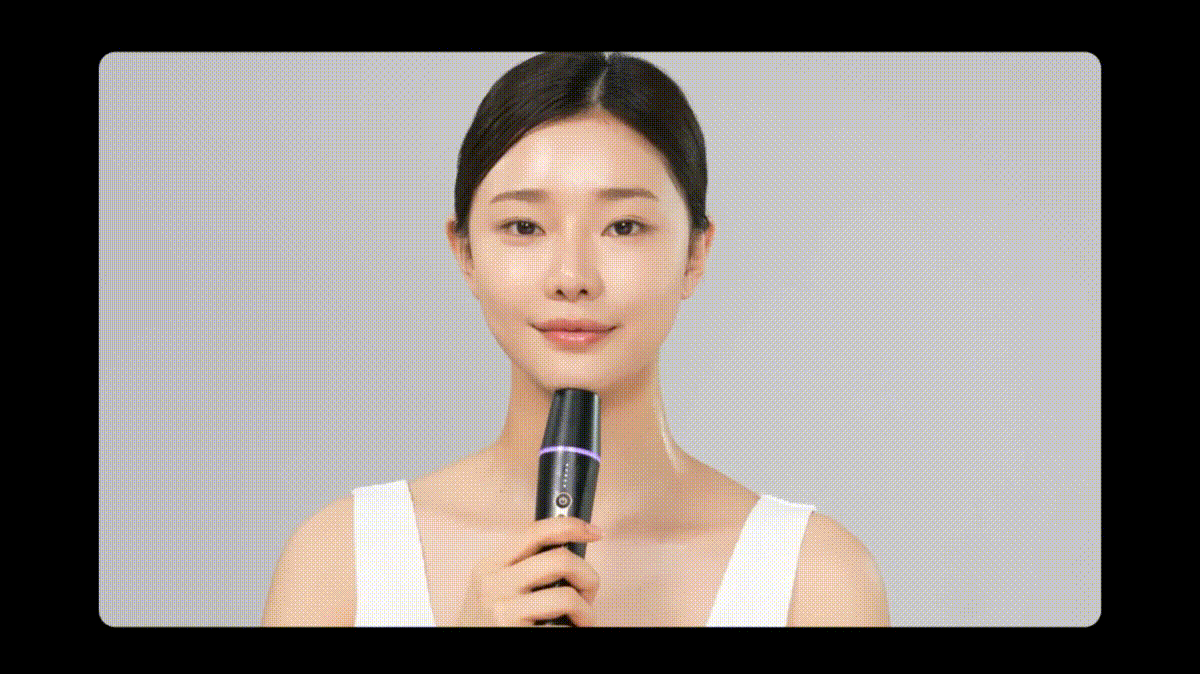 Woman using Centellian 24 Madeca Prime Infinity beauty device at home