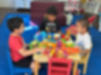 Young children playing pretend lunch