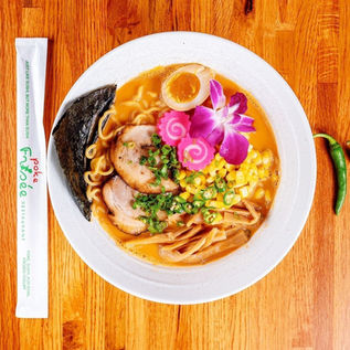 Delicious ramen bowl with pork, egg, and corn