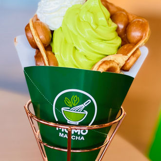 Matcha bubble waffle cone with whipped cream Momo Matcha green dessert