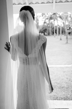 Wedding photography, detail of bride looking out over garden