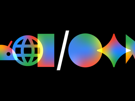 A stylized, multi-colored gradient Google I/O logo on a solid black background, seamlessly blending the "I/O" text with developer icons including curly braces, the Android robot head, a web globe, the Gemini AI star, and a mouse cursor.