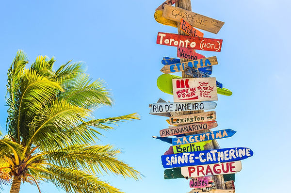 Colorful signpost showing various destinations