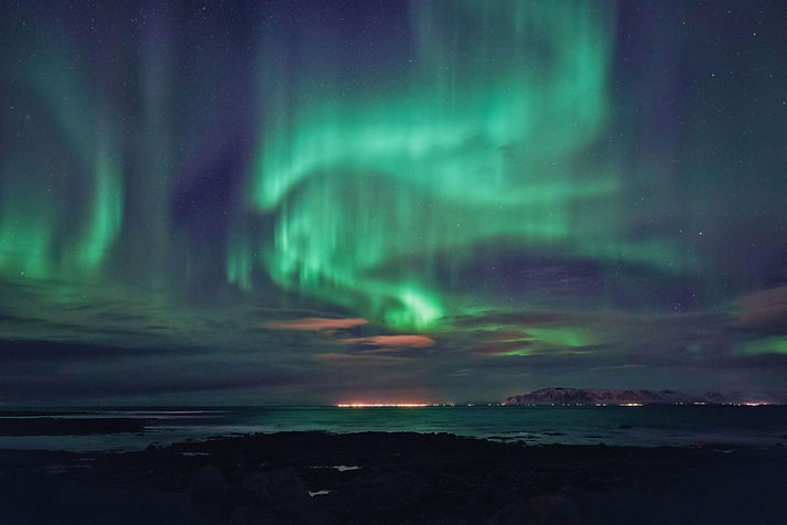 Epic Aurora Borealis over Reykjavik, Iceland - Neil Mark Thomas