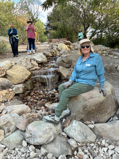 Beverly on a convenient perch at the bottom of the falls with Susanna, Katie and Marna in the background.