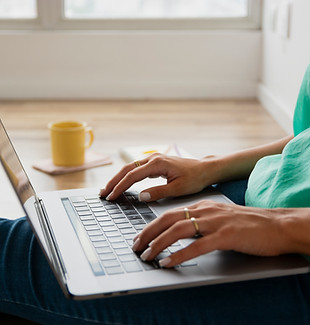 close-up-woman-sitting-floor-working.jpg