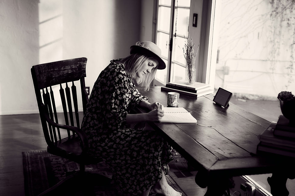 What to say in an obituary: person writing a meaningful tribute while reflecting on memories, stories, and legacy.
