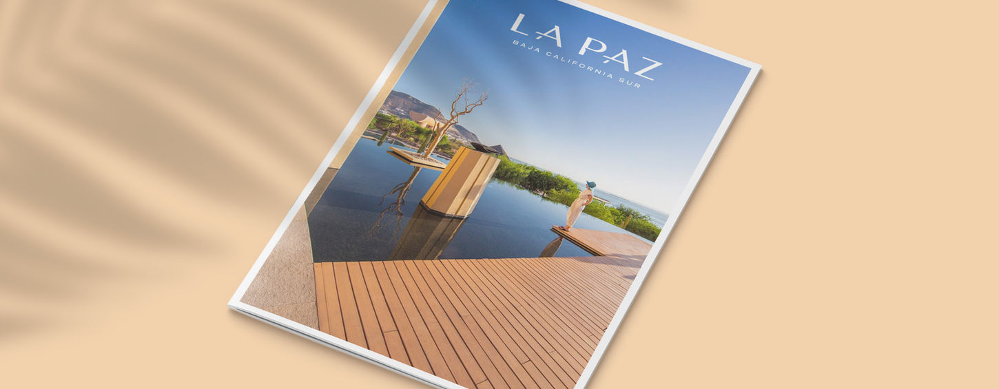 Mockup of La Paz Visitors Guide featuring girl by the pool