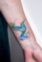 fine line watercolour tattoo hummingbird