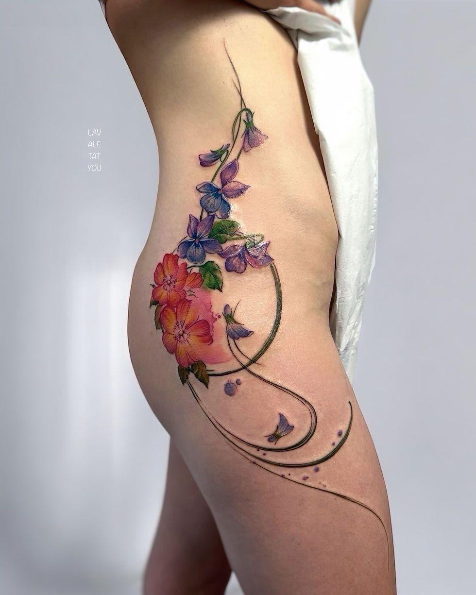 abstract botanical flowing watercolour tattoo hip