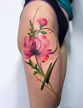 abstract watercolour thigh poppy tattoo