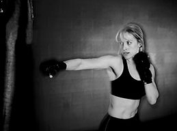Kickboxing female showing physical fitness and self defense striking
