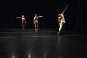 three dancers posing synchronously in contemporary dance performance