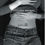 Miniature : Photo en noir et blanc d'une jeune femme qui se tient son ventre entre un jean et un pull levé, couverture Portraits Secrets
