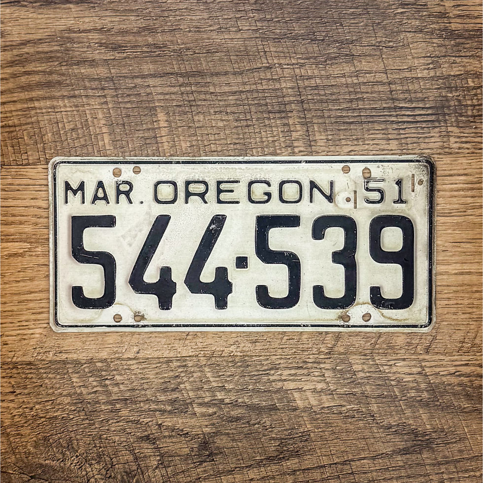 An original Oregon 1951-55 license plate.