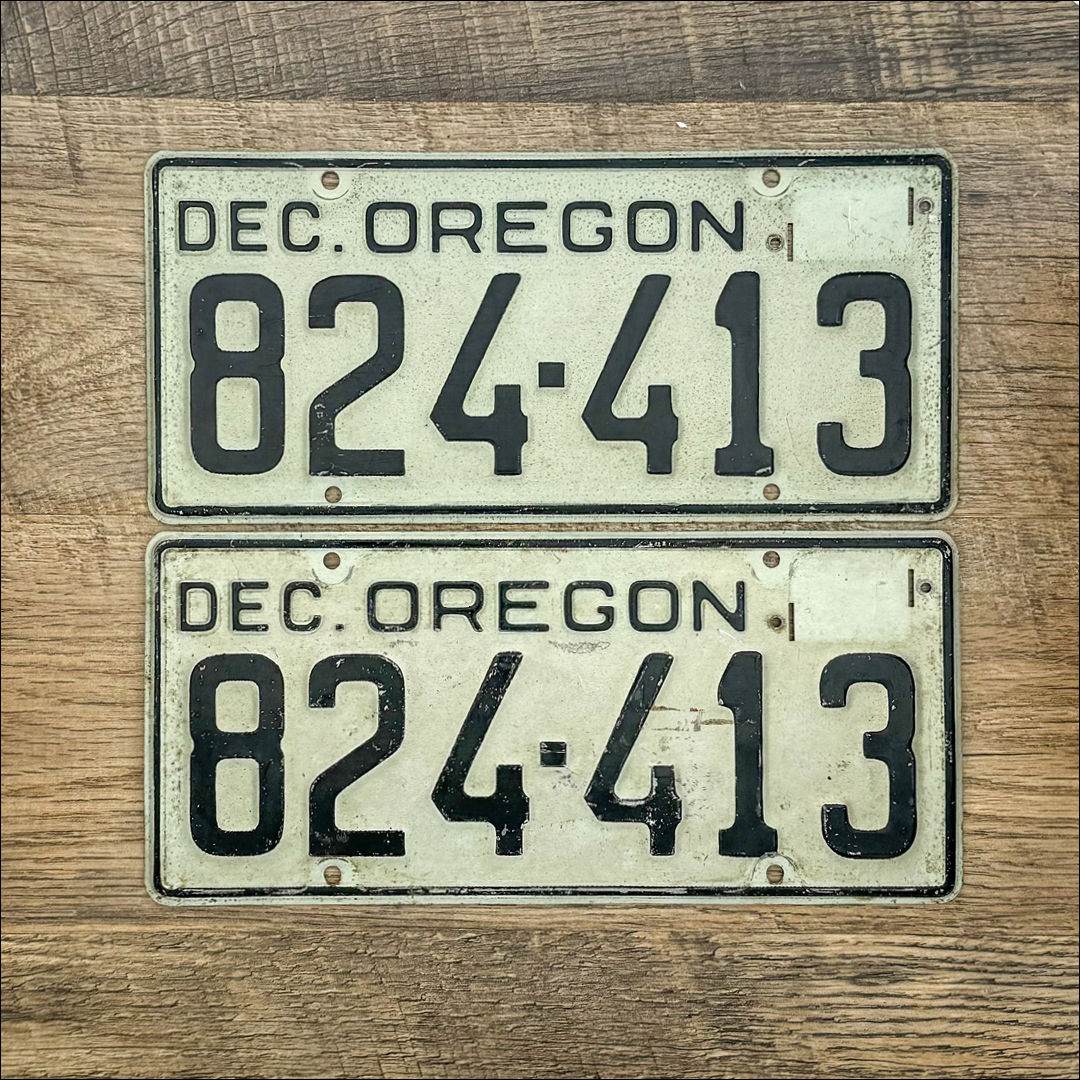An original pair of Oregon 1951-55 license plates. Silver with black lettering. #824-413