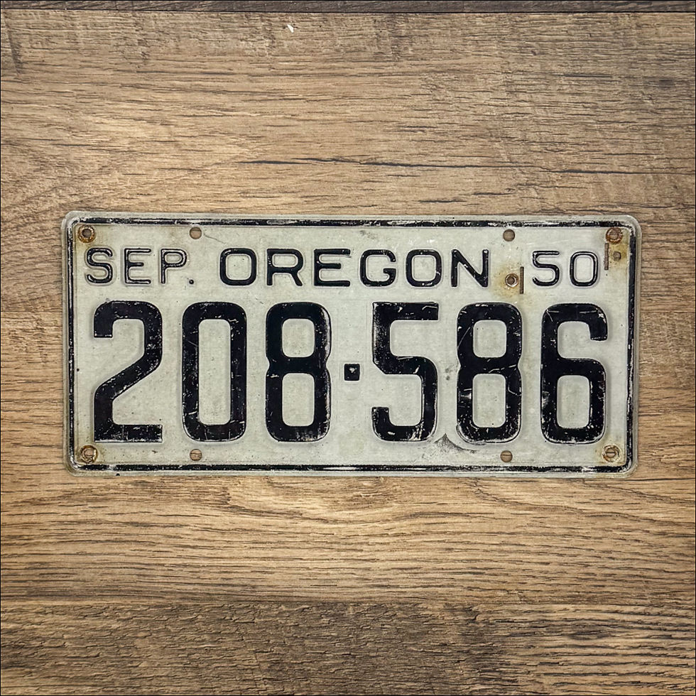 An original Oregon 1950-55 license plate.
