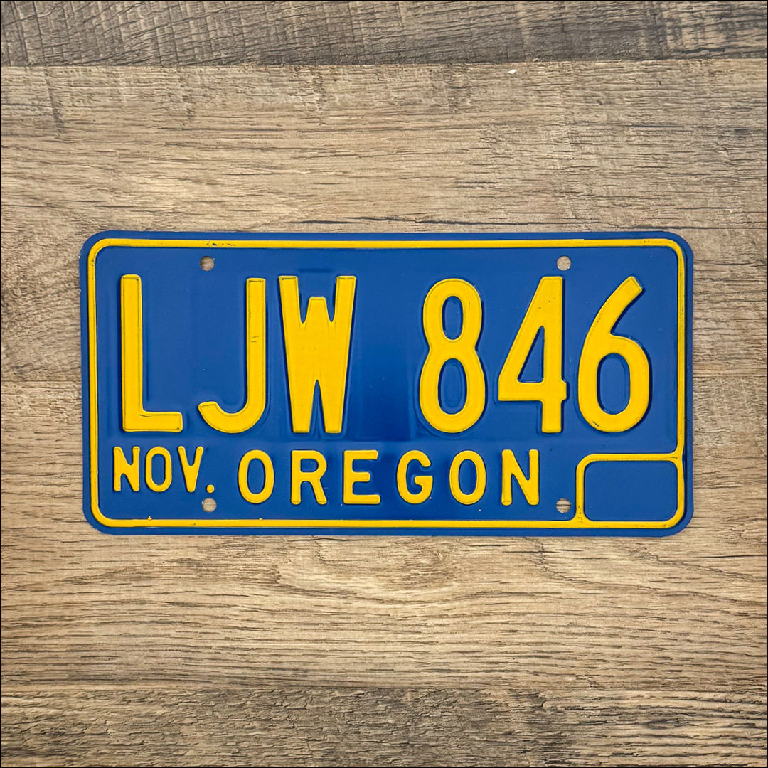 An original Oregon 1965-73 license plate. Blue with yellow lettering.