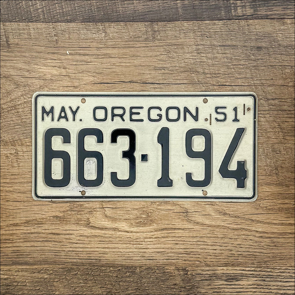 An original Oregon 1951-55 license plate.