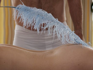 Use of feather in sensual massage