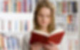 Woman reading a book in library