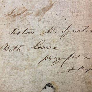 Close up photo of an inscription in black ink